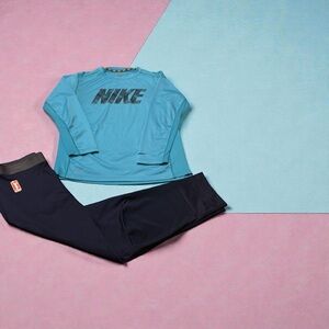 Girls Nike Teal Shirt and Navy Pants Set.The pants have the WNBA logo